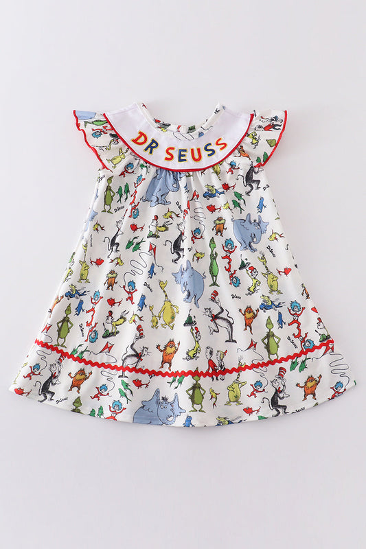A Dr. Seuss themed embroidery dress with a ruffled collar and red trim detailing, displayed on a white background.